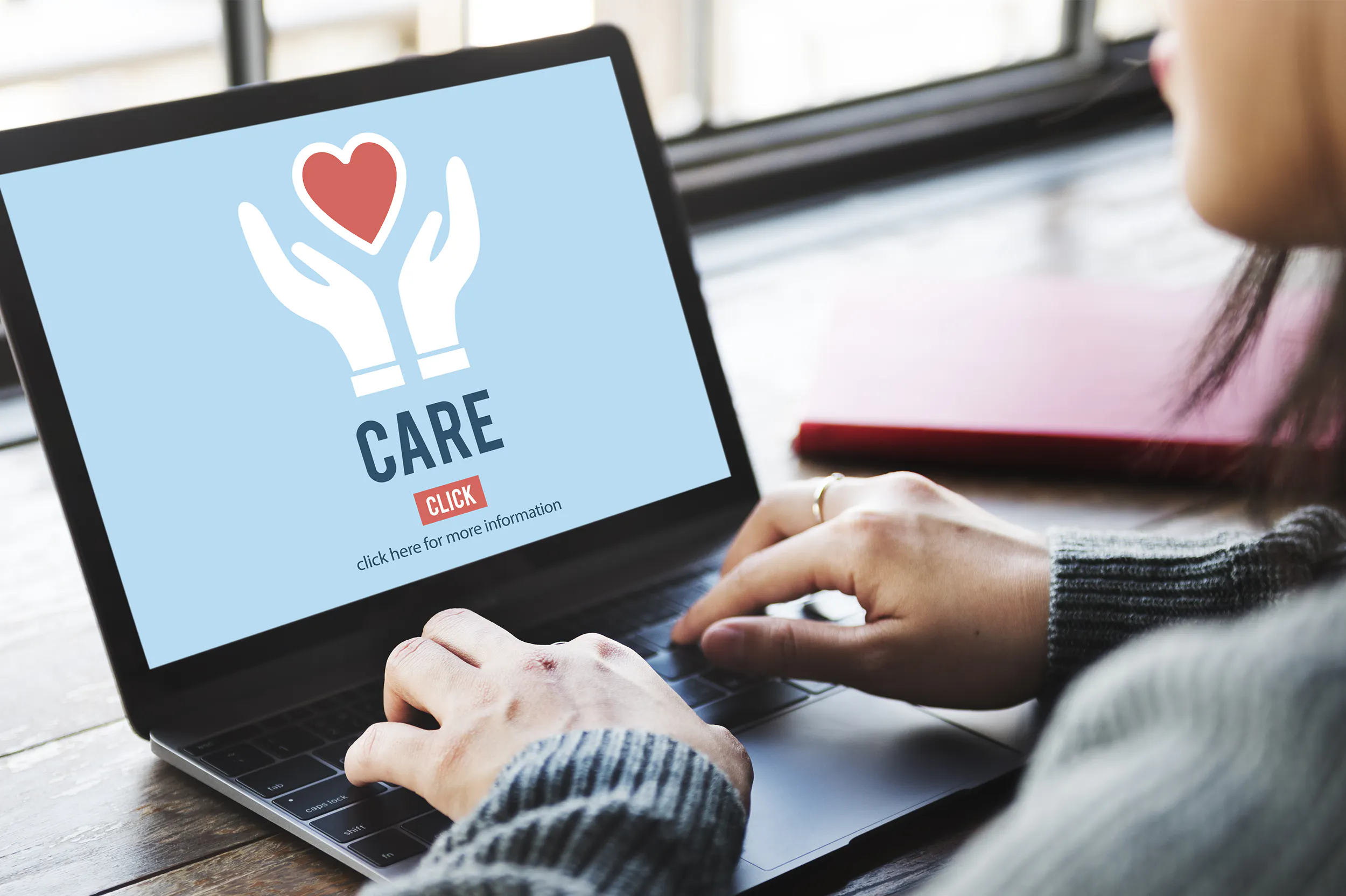 Woman caring and giving back on the computer.